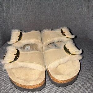 Birkenstock Beige Shearling Sandals with Gold Buckles